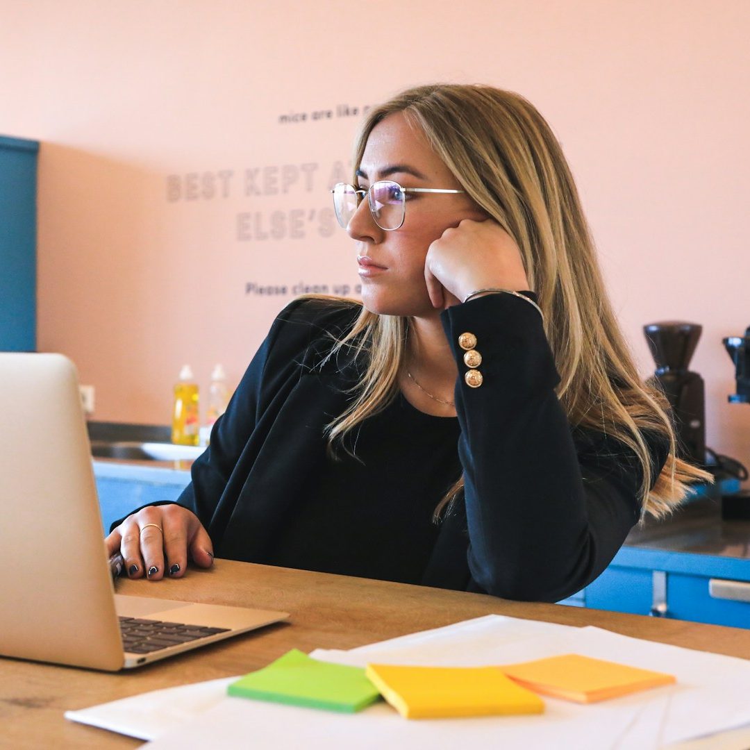 A jobseeker preparing for interview at a laptop